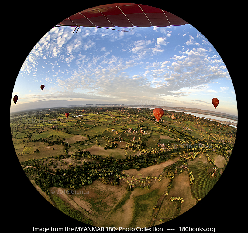 Image of Other balloons, the Irrawaddy River and a white speck on the mountain that is Mt. Popa