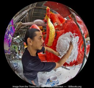 Image of An artisan adds plaster while constructing a float sculpture.