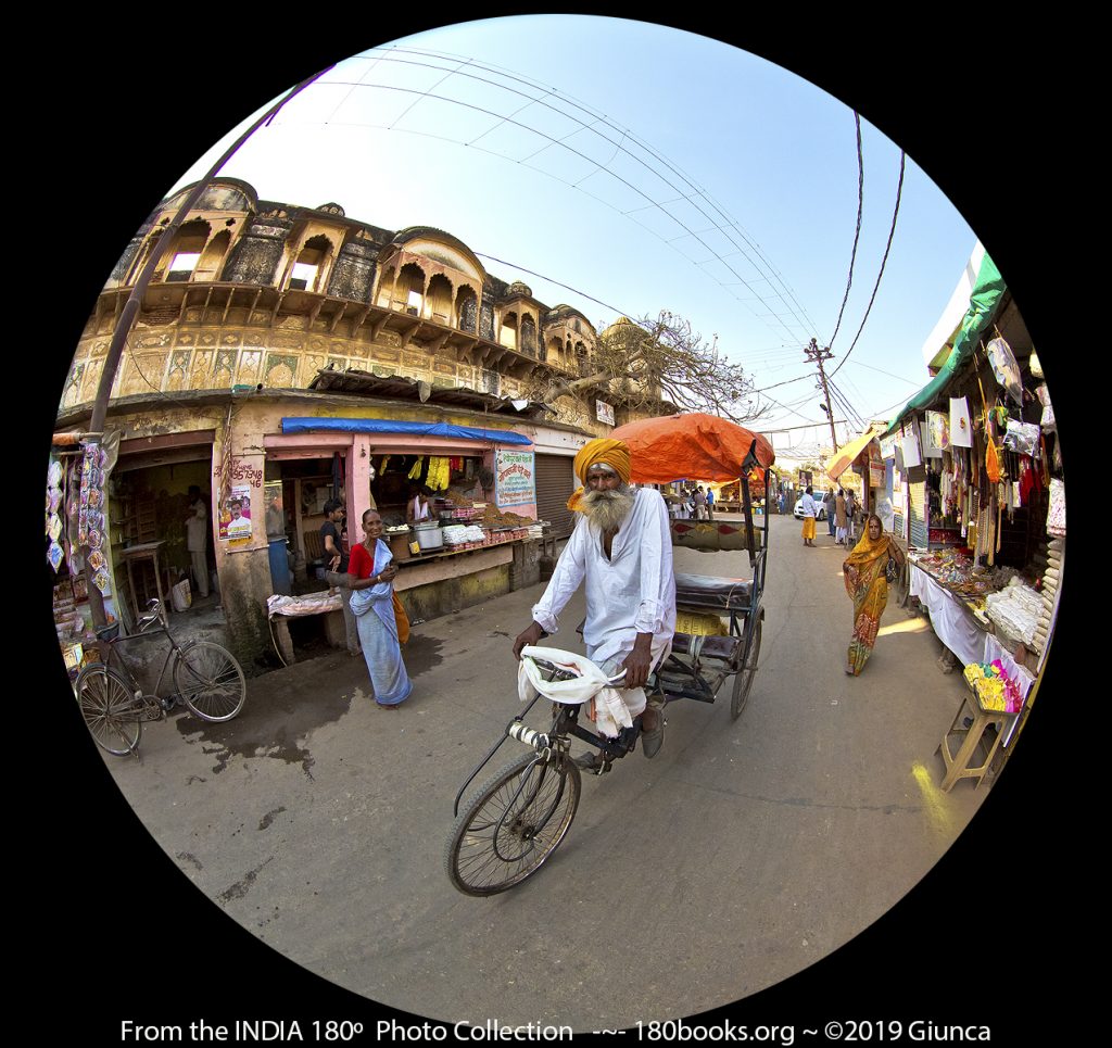 Man riding a trycycke rickshaw